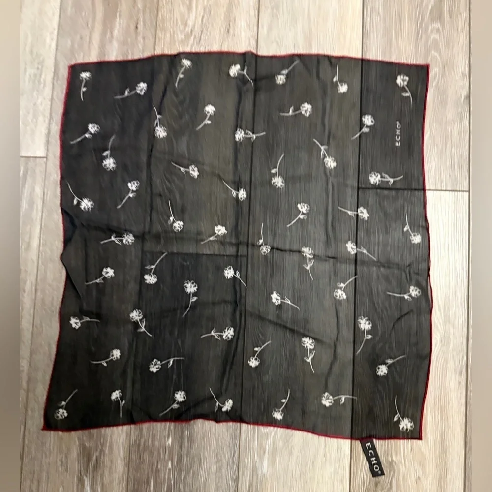 ECHO Small Black Sheer and stretch Scarf with white floral and red outline.